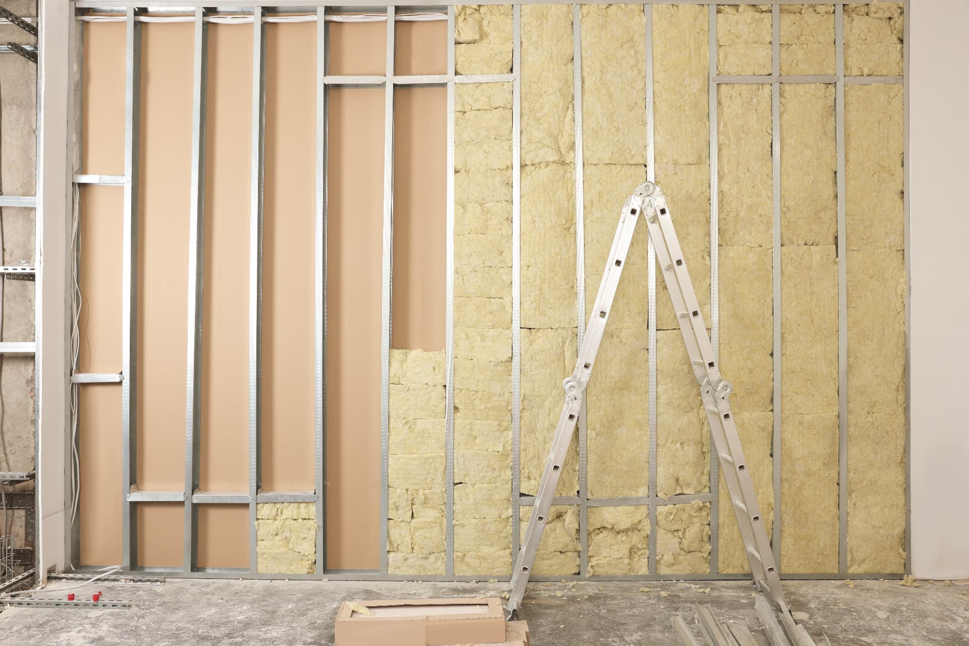 Metal stud framing with insulation in wall construction