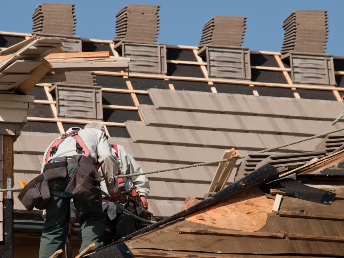 Roofer working on residential roof replacement