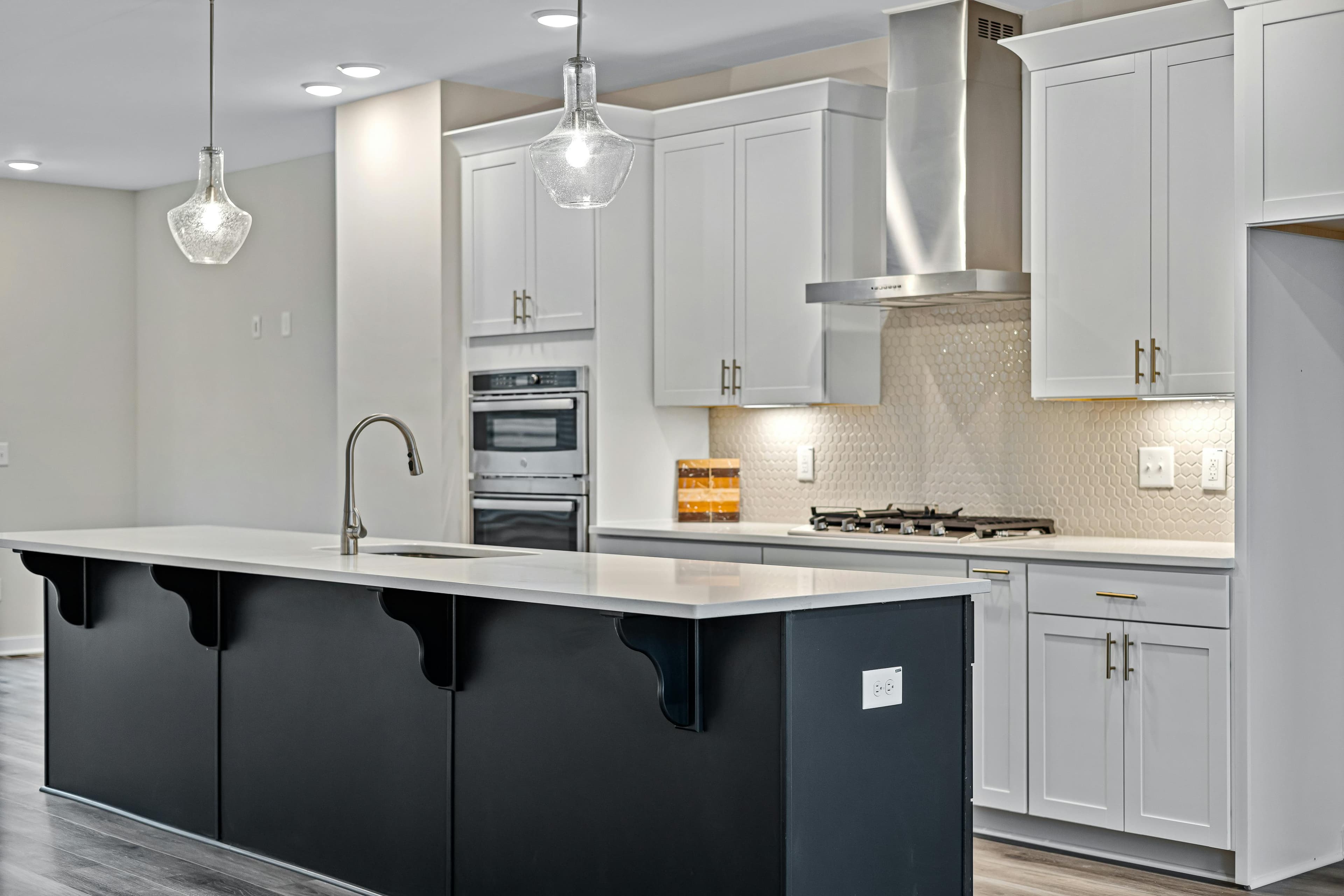 Layered lighting setup in modern kitchen