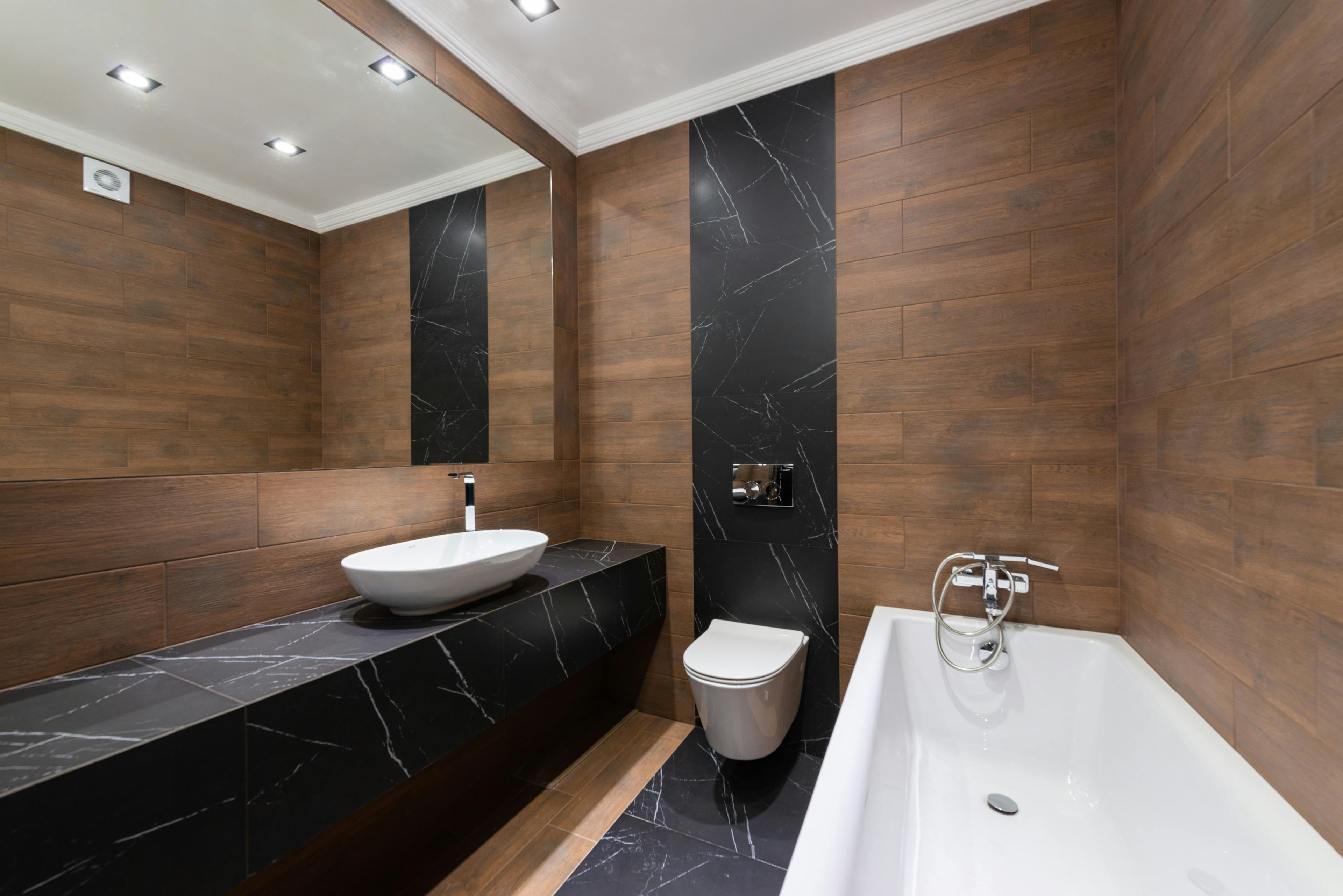 Layered lighting in a contemporary bathroom