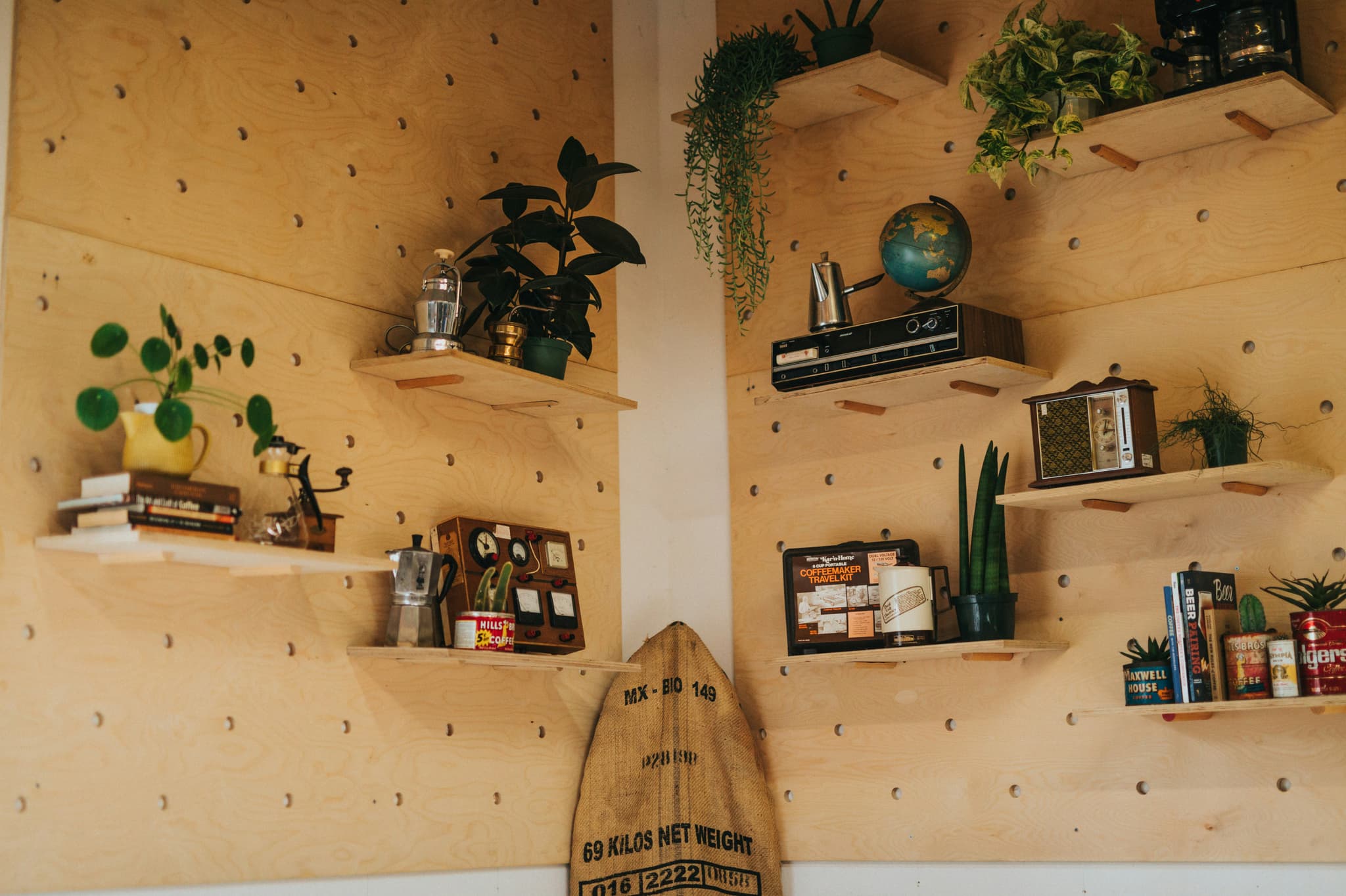 Essential oils and spa decor on floating shelf
