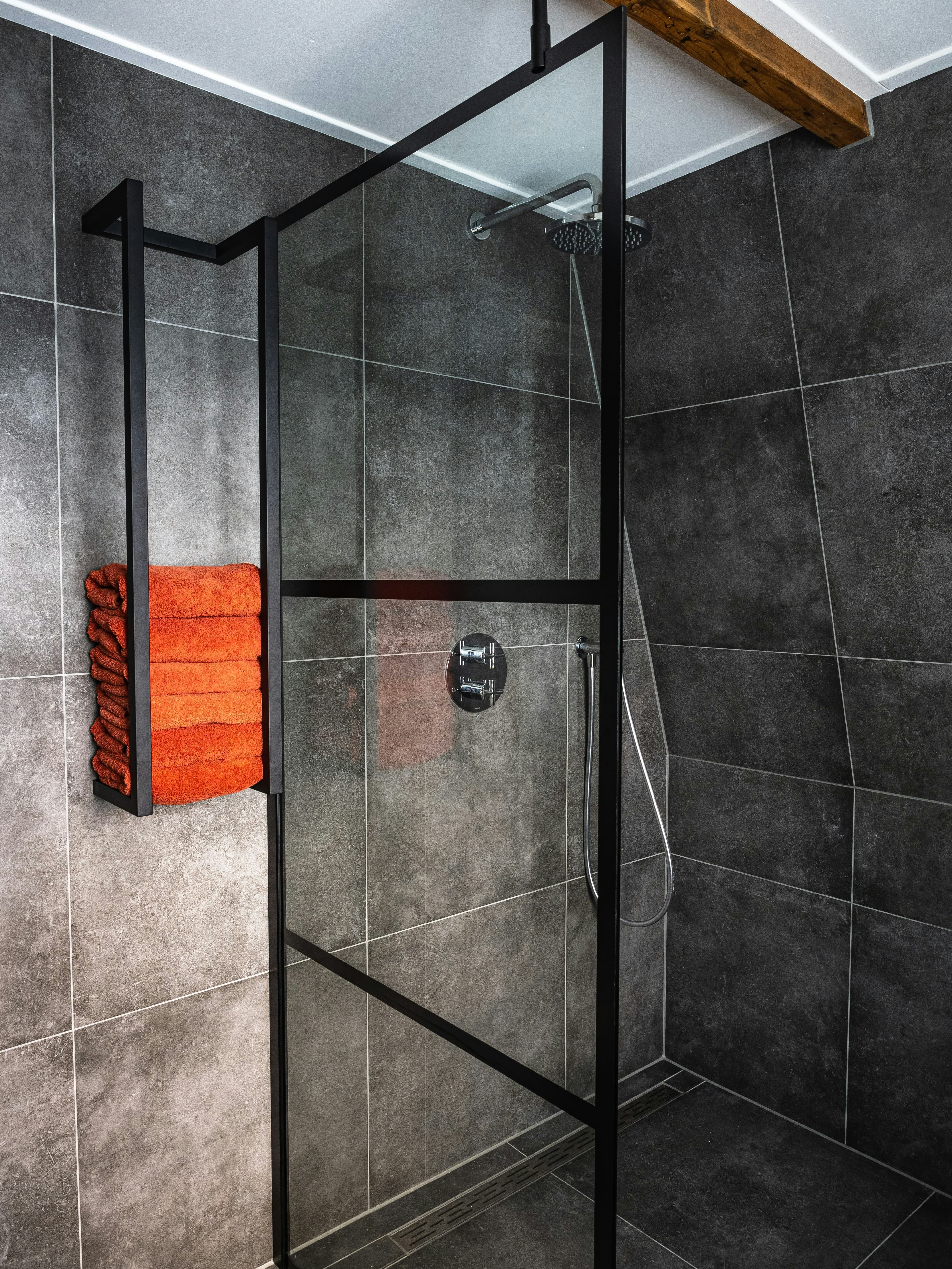 Zero-threshold walk-in shower with grab bars for seniors