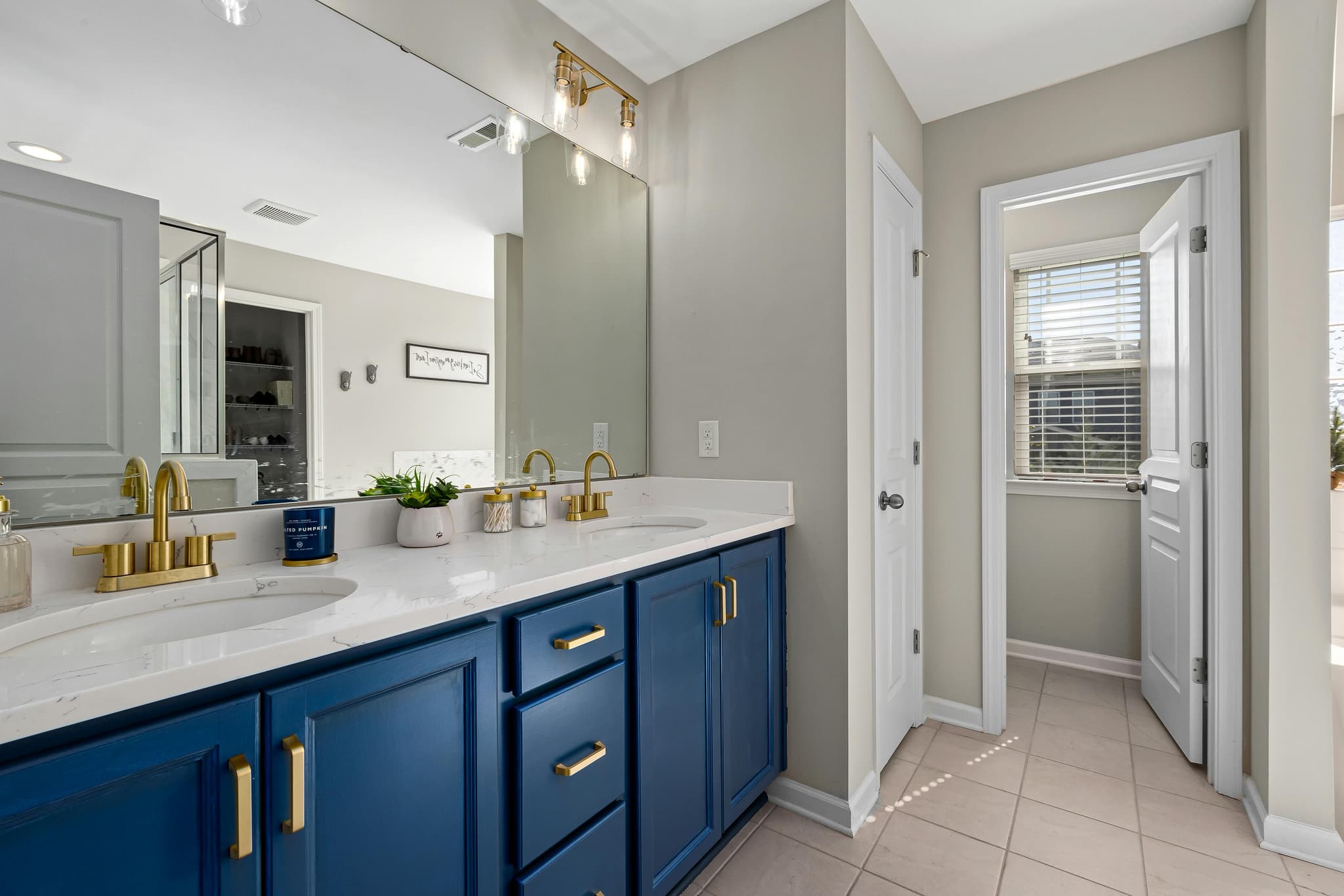 Floating vanity and clean layout design for better air circulation
