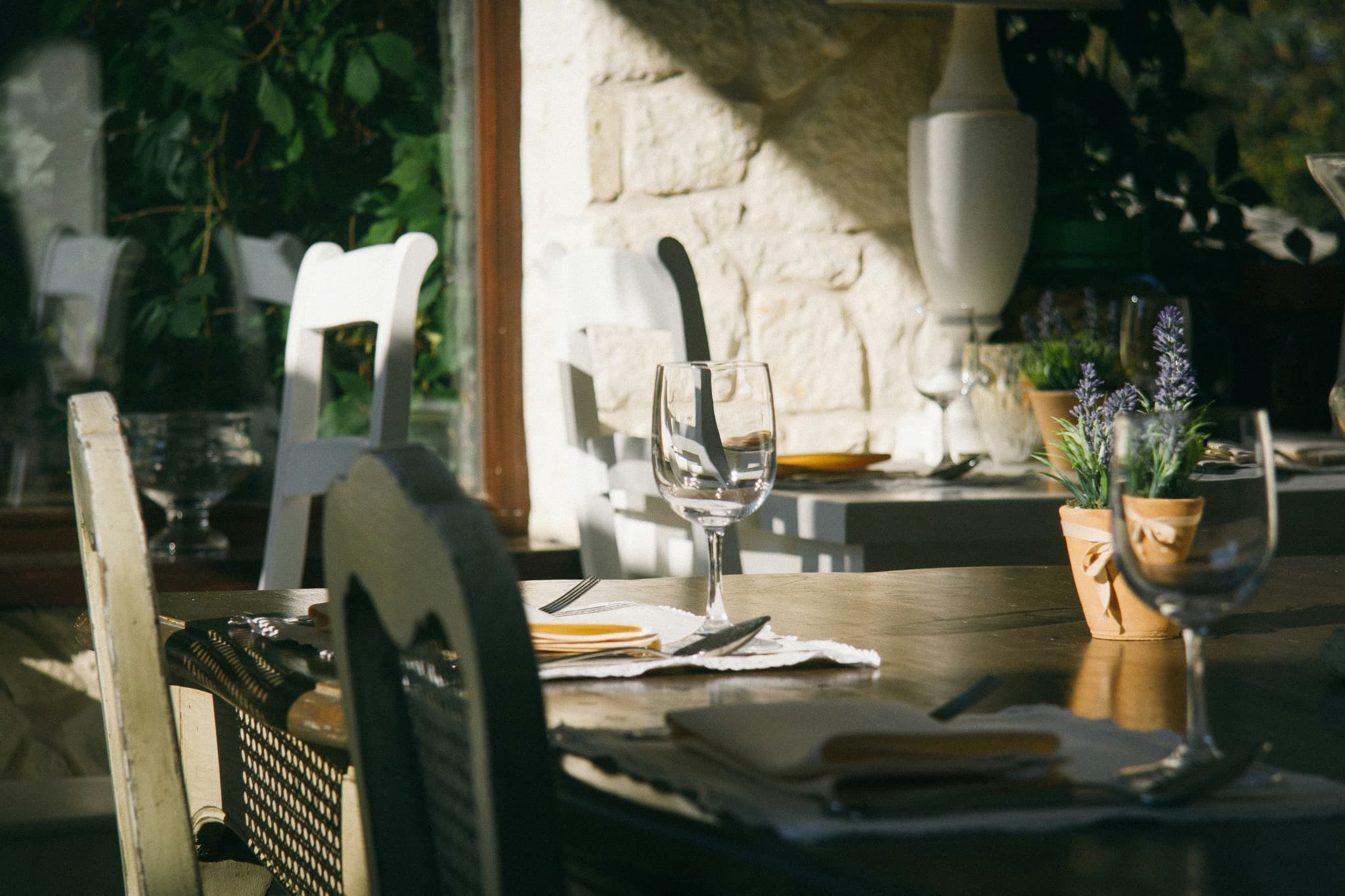 Stone countertops and natural textures in outdoor cooking area